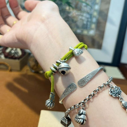 Green Wealth Pouch Bracelet – Handwoven Lucky Cord Amulet