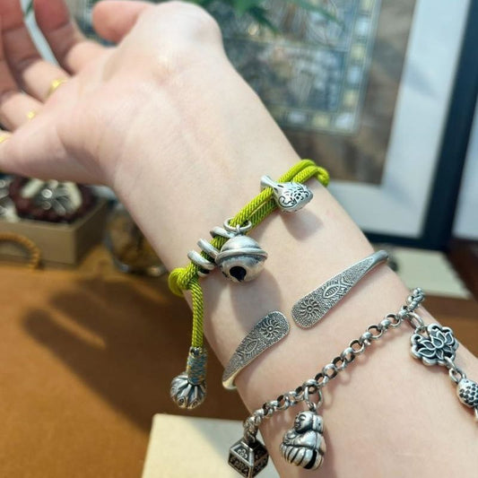 Green Wealth Pouch Bracelet – Handwoven Lucky Cord Amulet