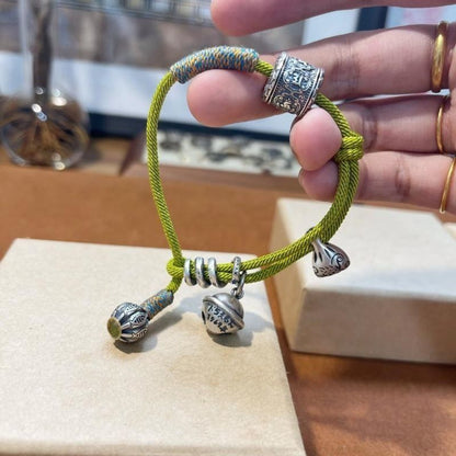 Green Wealth Pouch Bracelet – Handwoven Lucky Cord Amulet